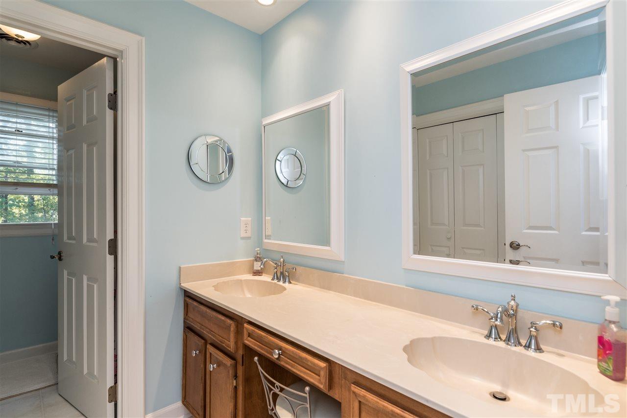 3104 Hickory Road Raleigh, NC 27616 - Photo 21 of 25 a bathroom with a sink and a mirror