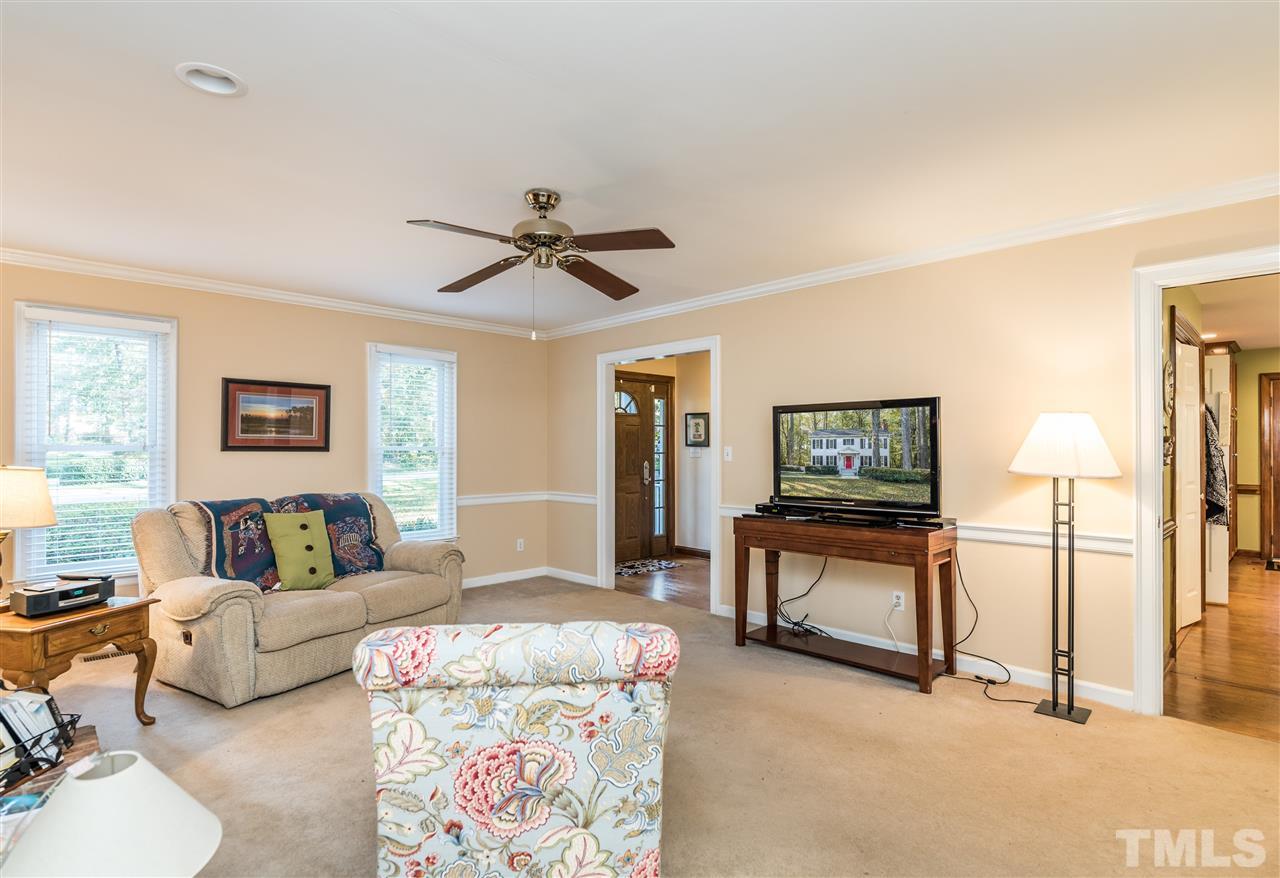 3104 Hickory Road Raleigh, NC 27616 - Photo 6 of 25 a living room with furniture and a flat screen tv