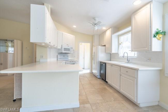 7630 Novara Court Naples, FL 34114 - Photo 12 of 33 a large kitchen with cabinets