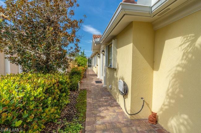 7630 Novara Court Naples, FL 34114 - Photo 5 of 33 a view of a pathway of a building