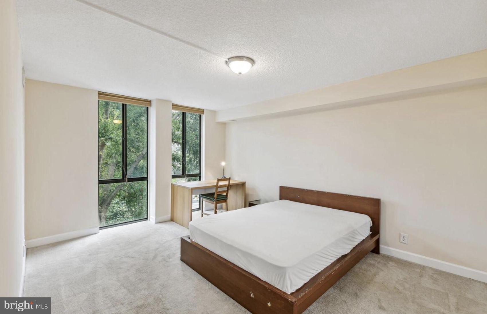 1401 North Rhodes Street, Unit 406 Arlington, VA 22209 - Photo 8 of 14 Bright and airy bedroom retreat.