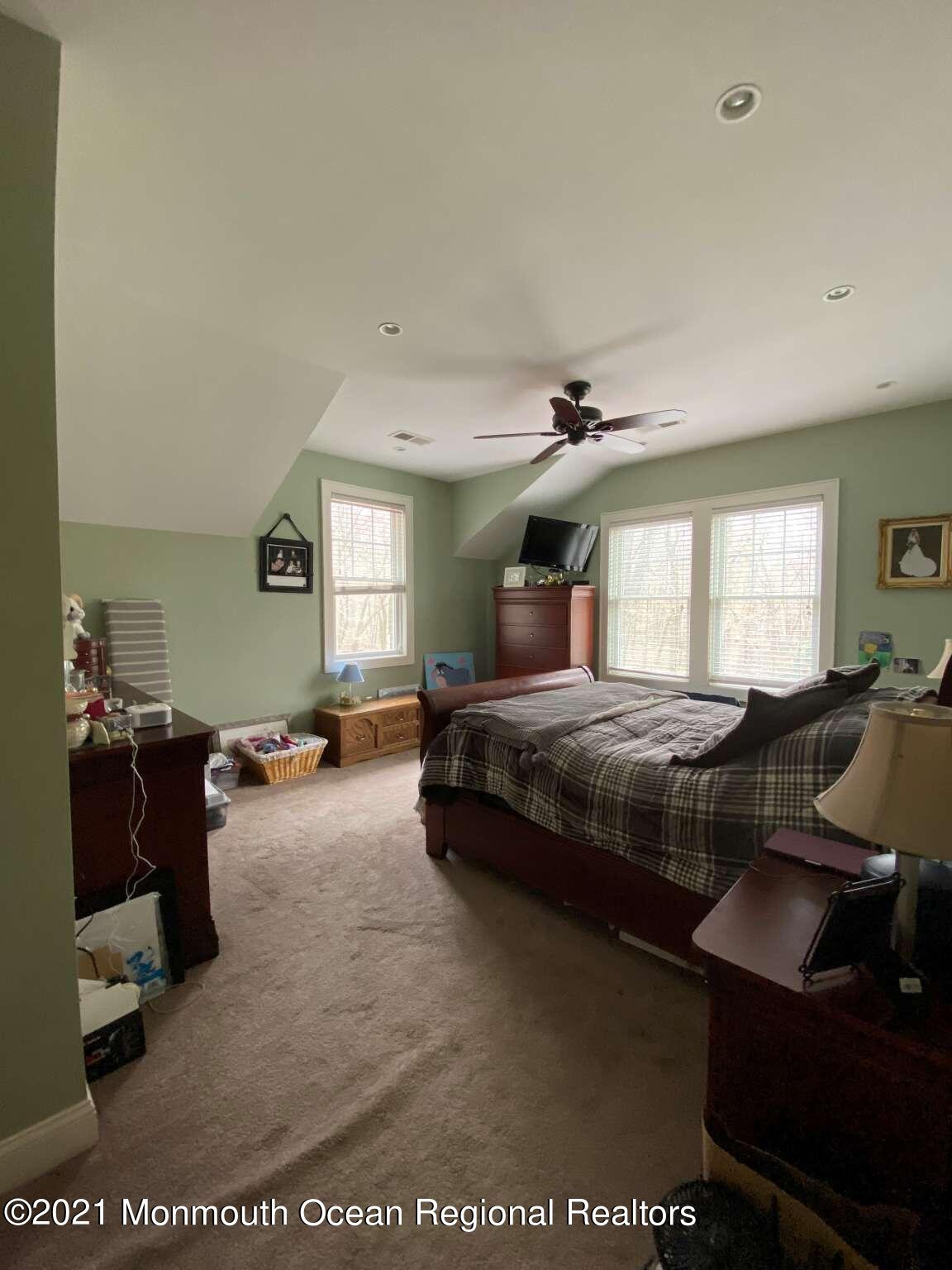 341 Oak Glen Road Howell, NJ 07731 - Photo 12 of 19 a bedroom with furniture and a window