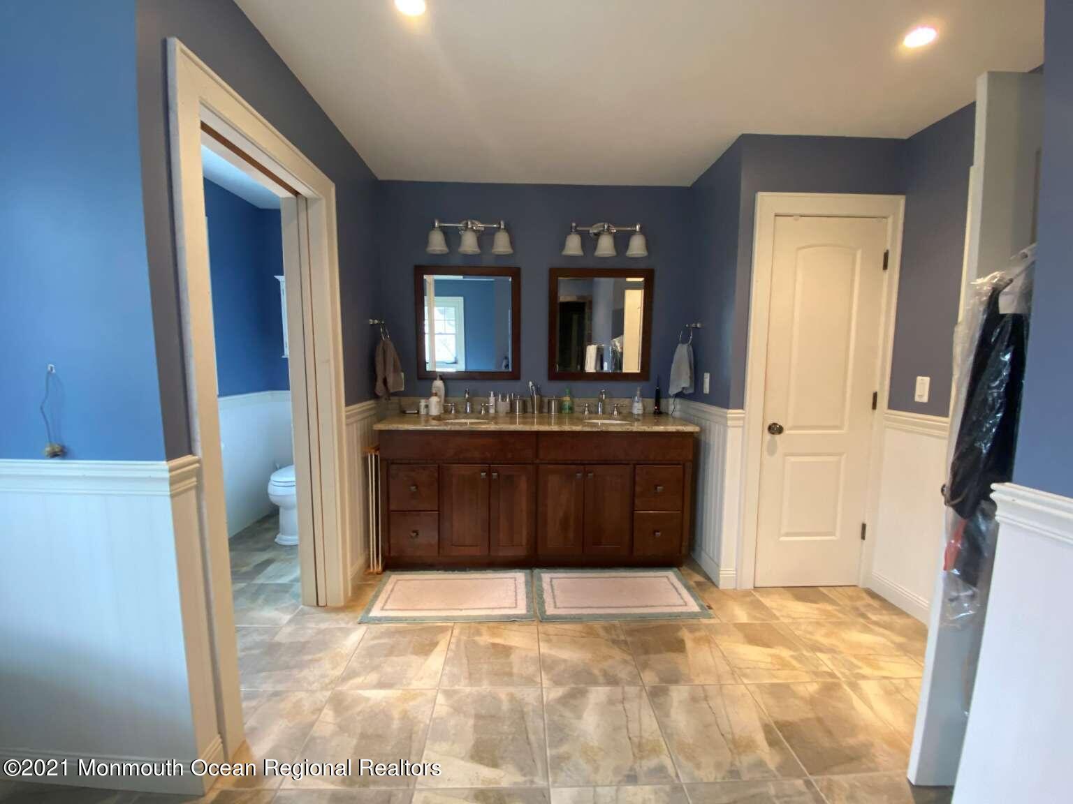 341 Oak Glen Road Howell, NJ 07731 - Photo 14 of 19 a view of a kitchen with a sink and a fireplace
