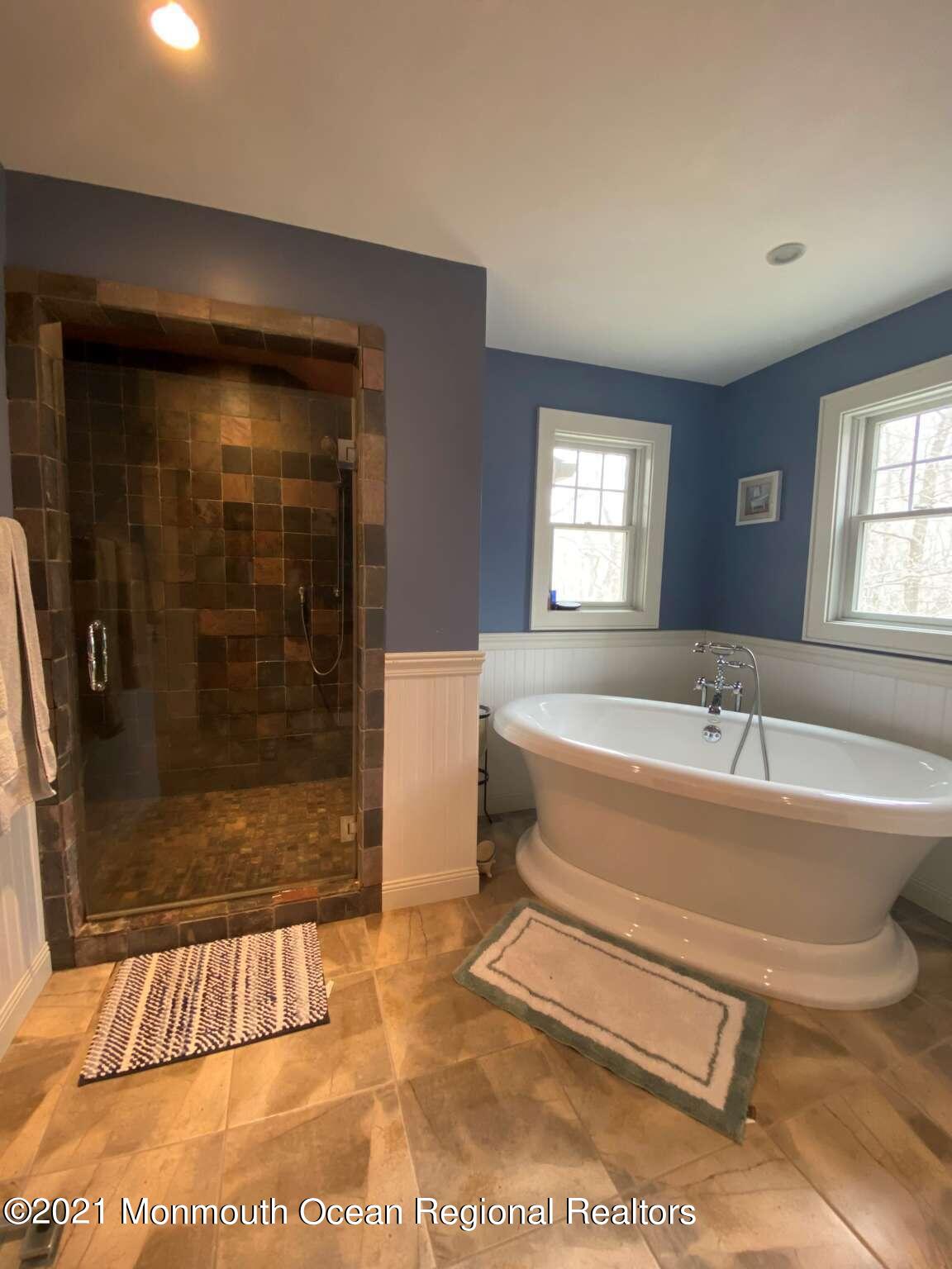 341 Oak Glen Road Howell, NJ 07731 - Photo 15 of 19 a spacious bathroom with a bathtub and a shower