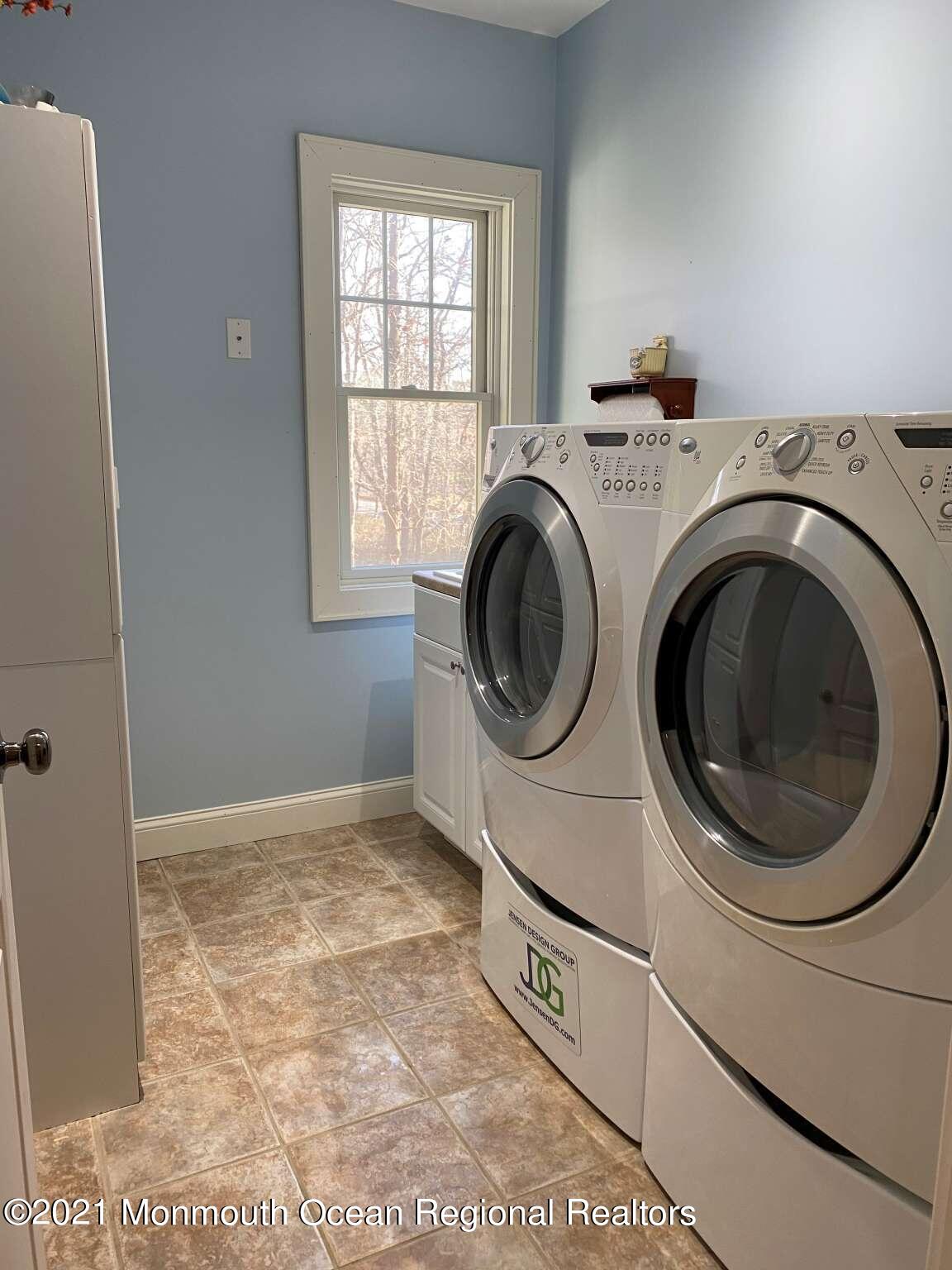 341 Oak Glen Road Howell, NJ 07731 - Photo 16 of 19 a view of entryway with washer and dryer