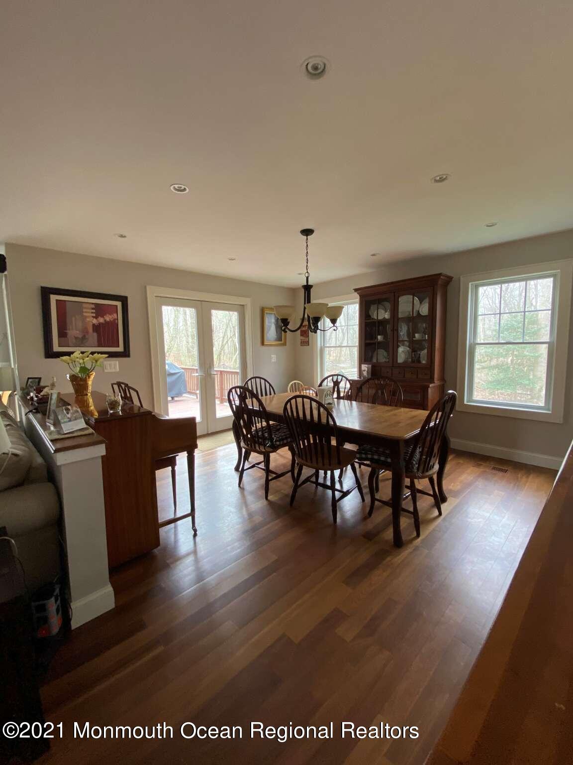 341 Oak Glen Road Howell, NJ 07731 - Photo 7 of 19 a view of a dining room with furniture window and wooden floor