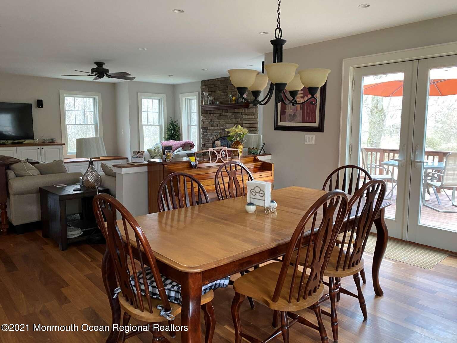 341 Oak Glen Road Howell, NJ 07731 - Photo 8 of 19 a view of a dining room with furniture window and wooden floor