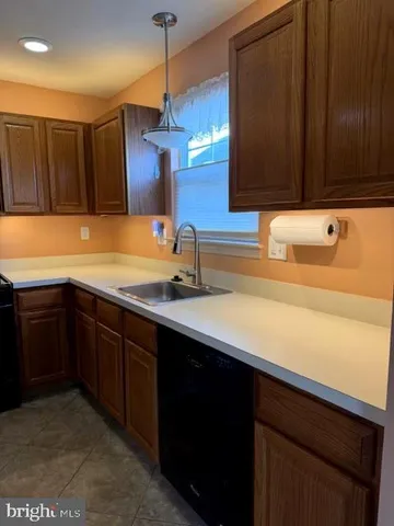 a kitchen with a sink and a cabinets