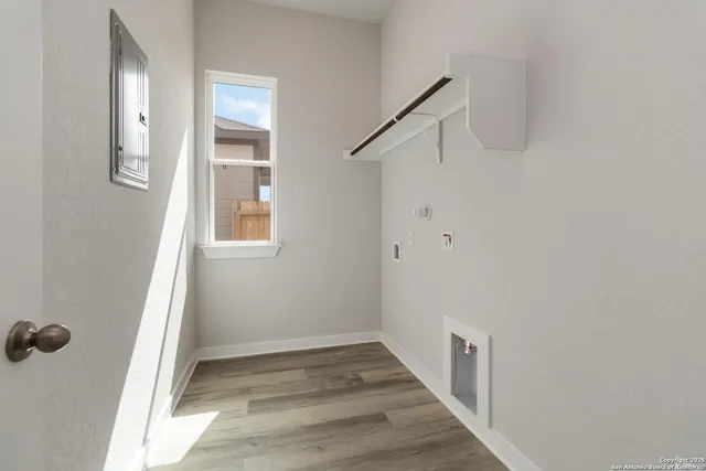 a view of an entryway with wooden floor