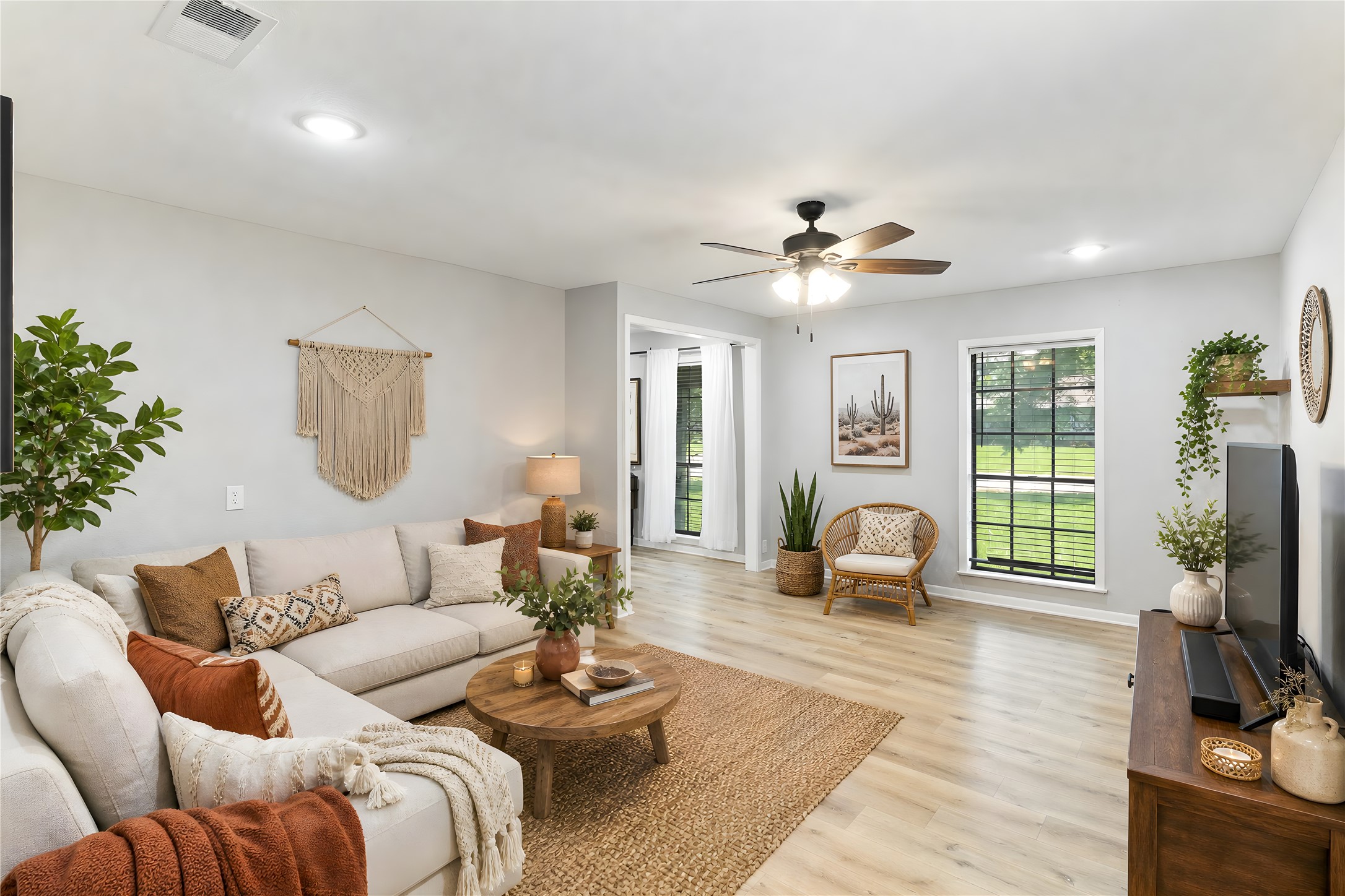 117 Cannon Street Clute, TX 77531 - Photo 12 of 24 Extended living area with a front-facing window and neutral finishes for a clean, comfortable look.