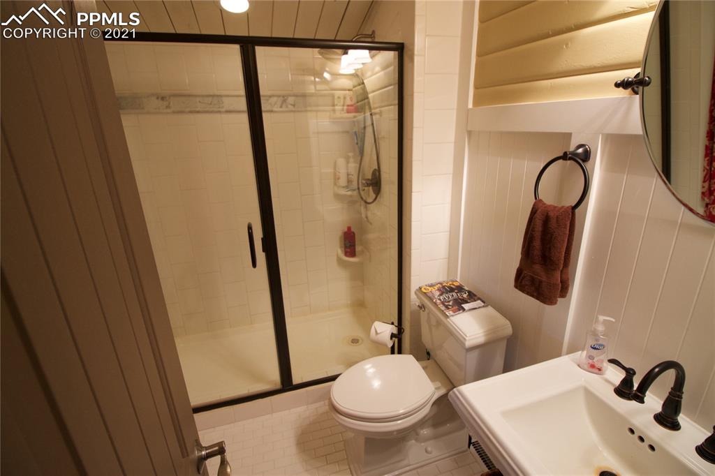 2160 Old North Gate Road Colorado Springs, CO 80921 - Photo 20 of 34 a bathroom with a sink toilet and shower
