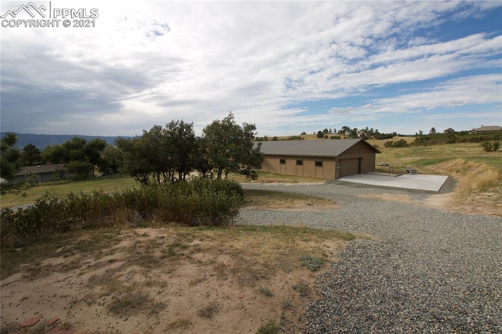 2160 Old North Gate Road Colorado Springs, CO 80921 - Photo 23 of 34 a view of a house with a yard