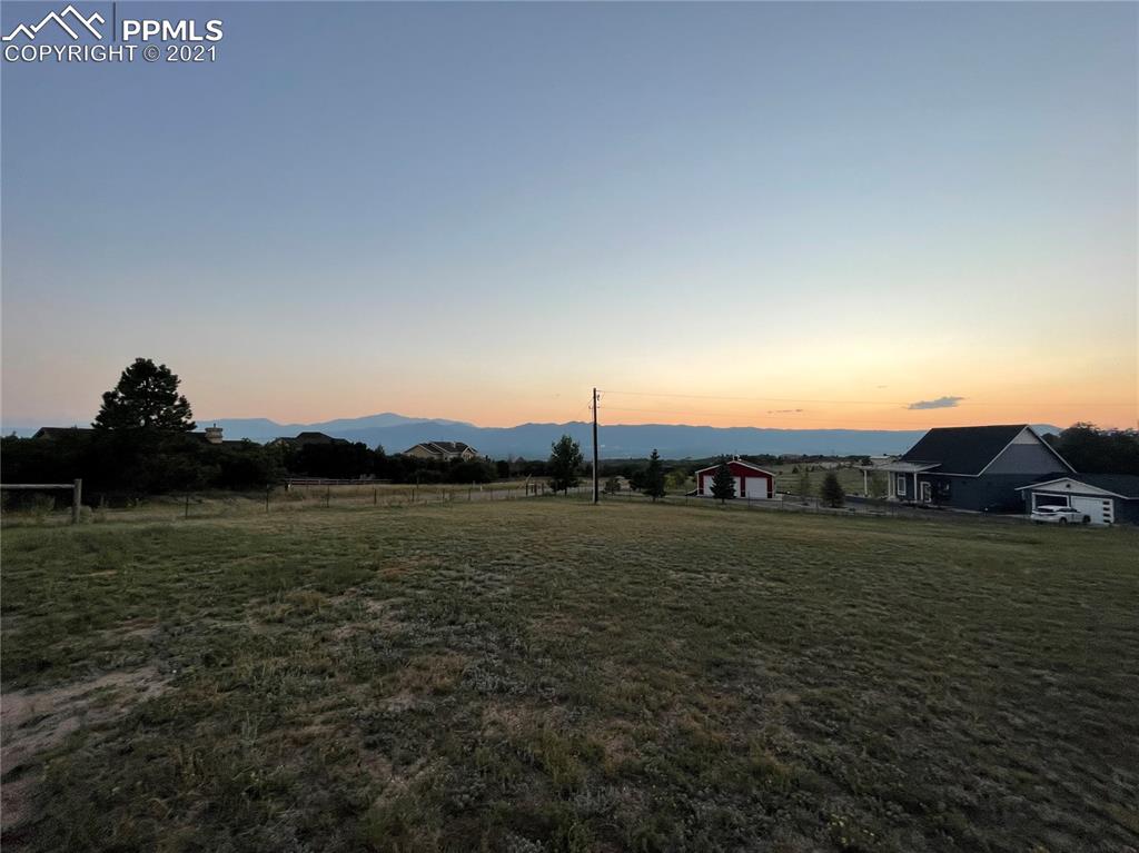 2160 Old North Gate Road Colorado Springs, CO 80921 - Photo 27 of 34 a view of a lake with houses in the back