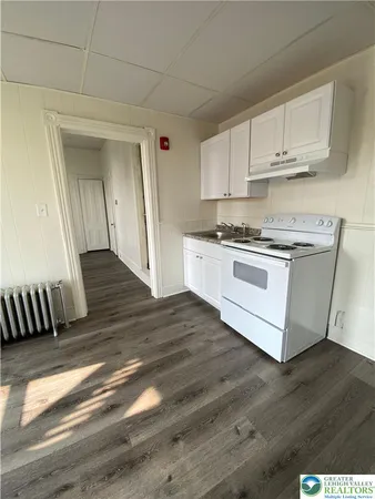 a kitchen with stainless steel appliances granite countertop a stove and a sink