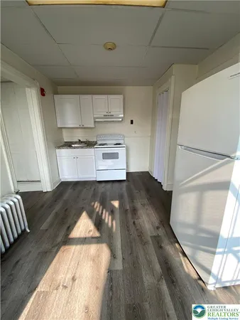 a view of kitchen and wooden floor