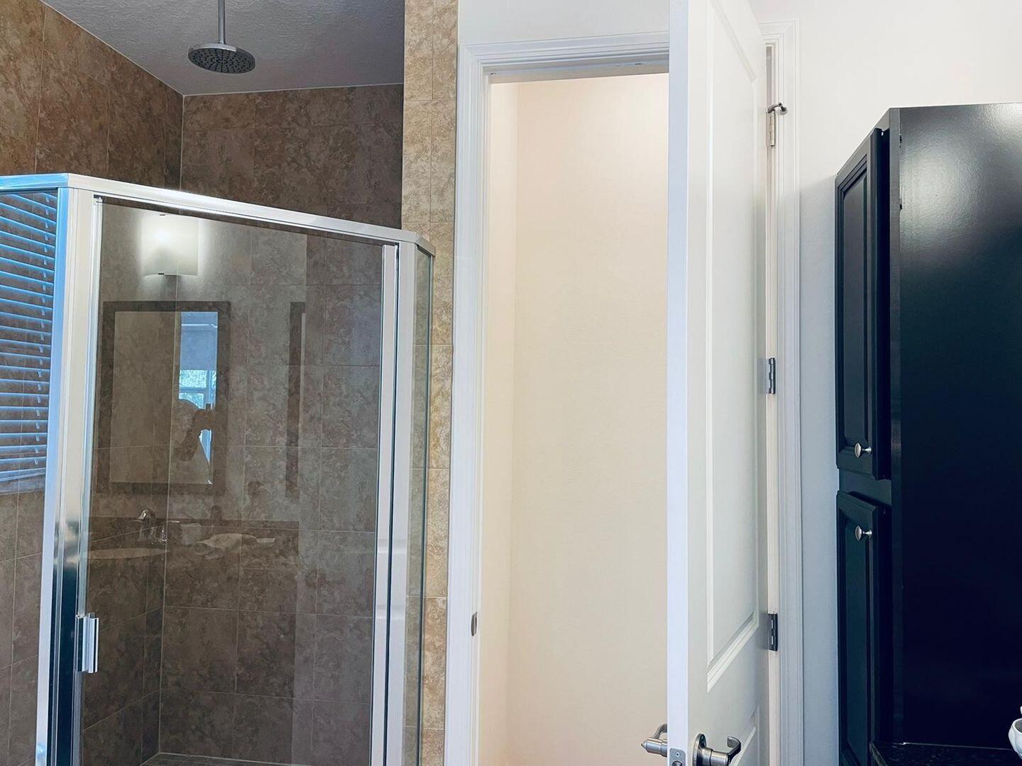 1527 Northwest 48th Lane Boca Raton, FL 33431 - Photo 16 of 23 a bathroom with a glass shower door