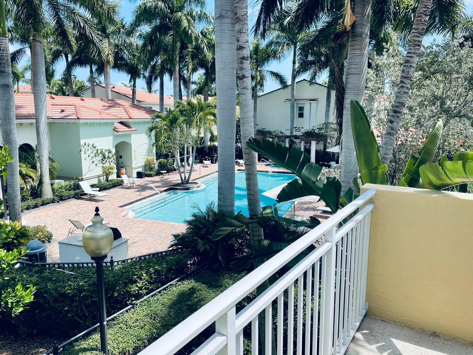 1527 Northwest 48th Lane Boca Raton, FL 33431 - Photo 18 of 23 a view of a house with fountain and a tree