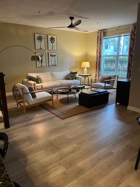 1527 Northwest 48th Lane Boca Raton, FL 33431 - Photo 7 of 23 a living room with furniture and wooden floor