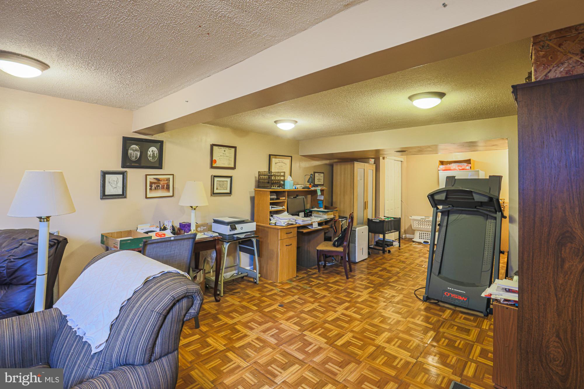 8205 Arrowhead Road Baltimore, MD 21208 - Photo 14 of 32 a living room with furniture window and flat screen tv