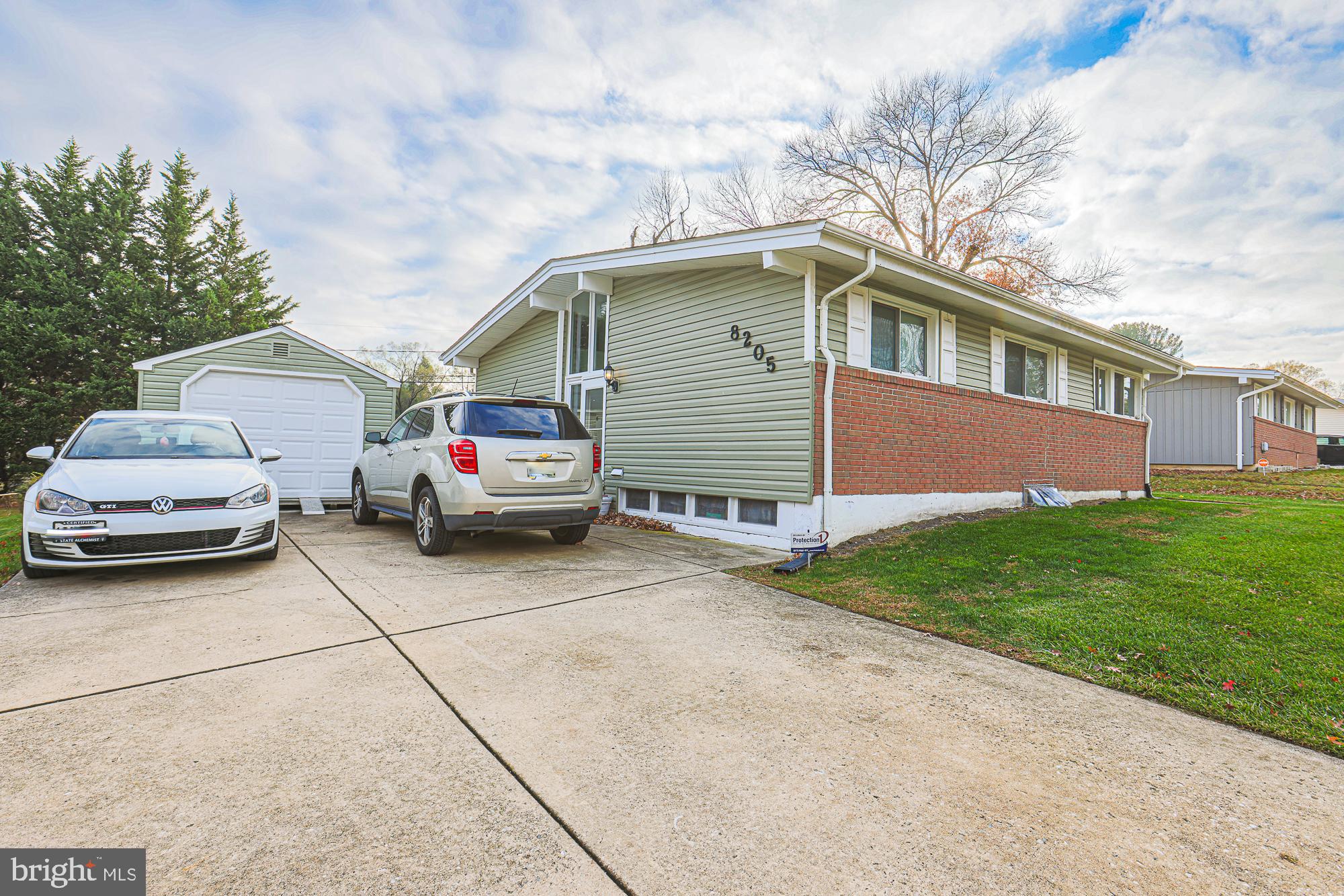 8205 Arrowhead Road Baltimore, MD 21208 - Photo 4 of 32 a car parked in front of a house