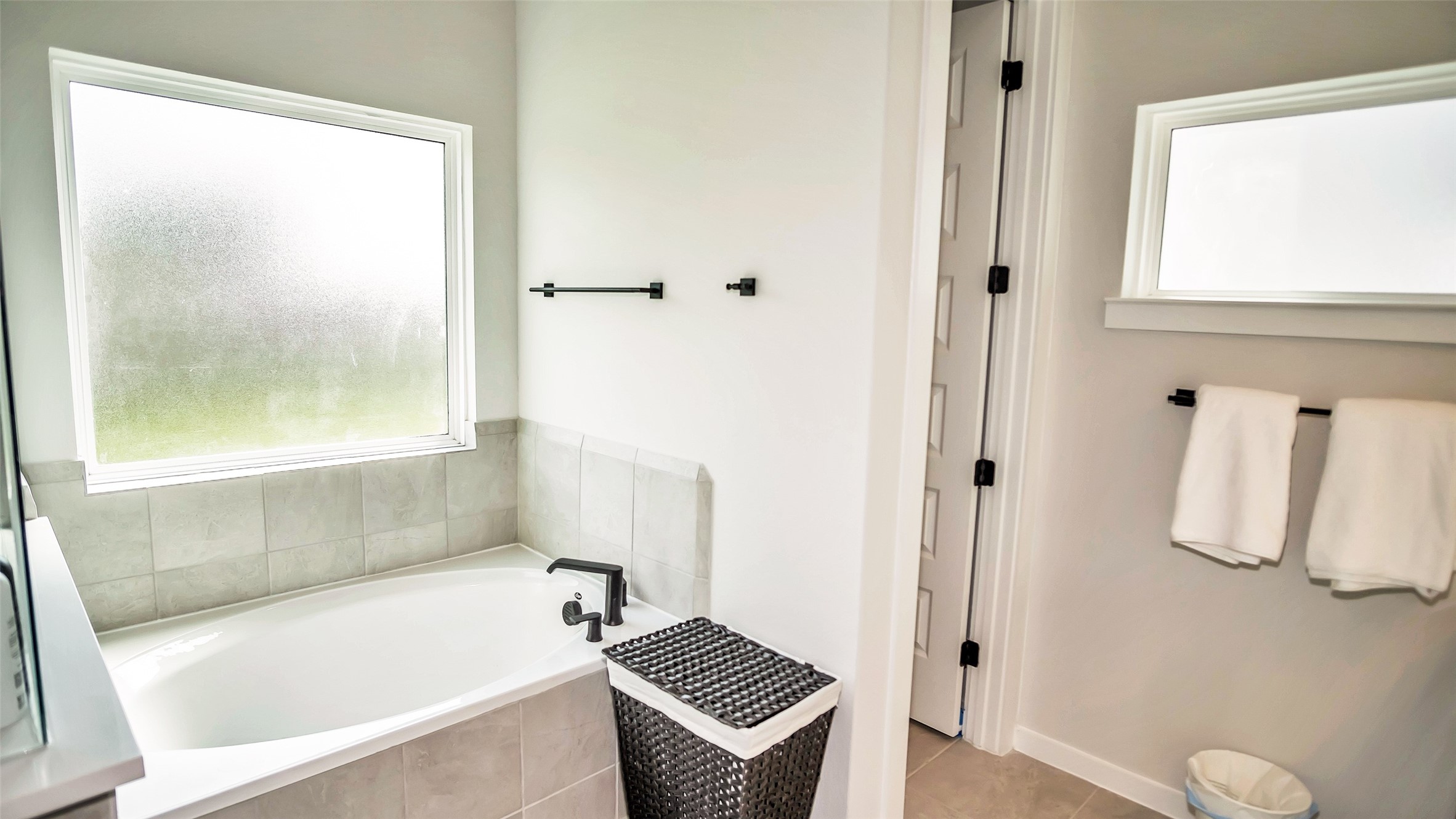 1919 Pueblo Nuevo Path Houston, TX 77077 - Photo 5 of 50 a bathroom with a tub and a shower