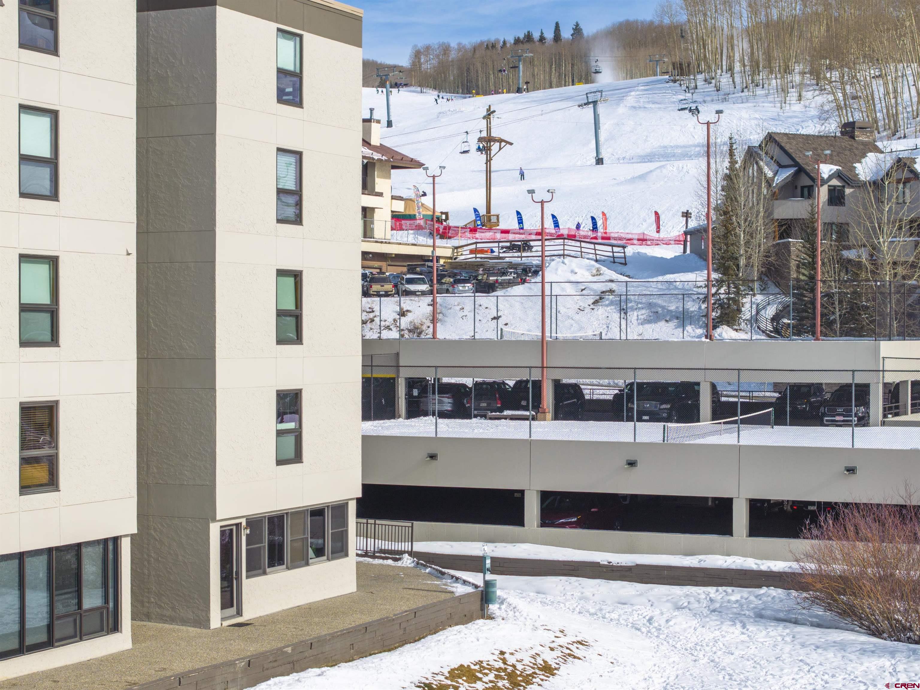 11 Snowmass Road, Unit 33 Crested Butte, CO 81225 - Photo 13 of 34 a front view of a building with glass windows