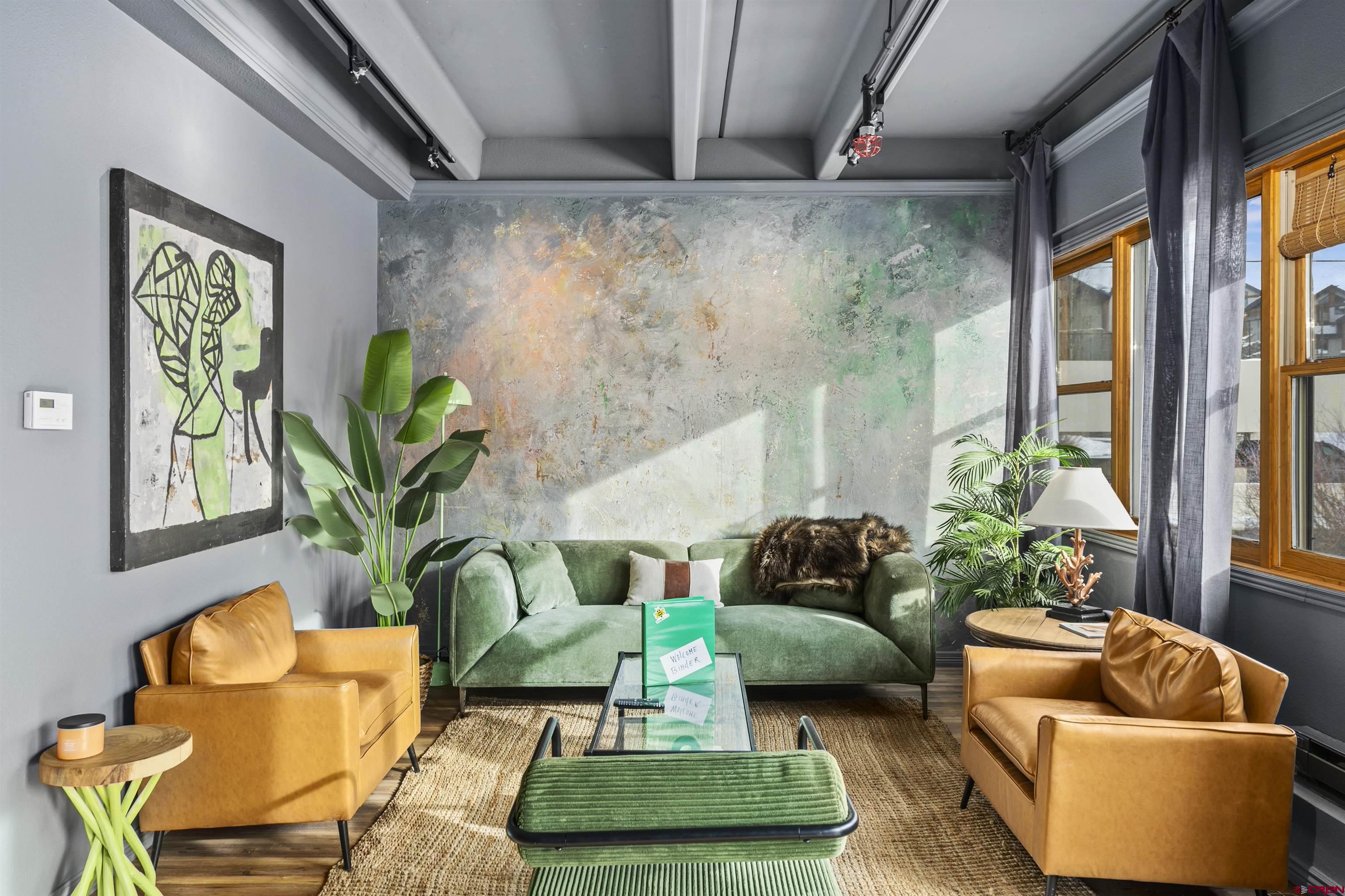 11 Snowmass Road, Unit 33 Crested Butte, CO 81225 - Photo 20 of 34 a living room with furniture and a potted plant
