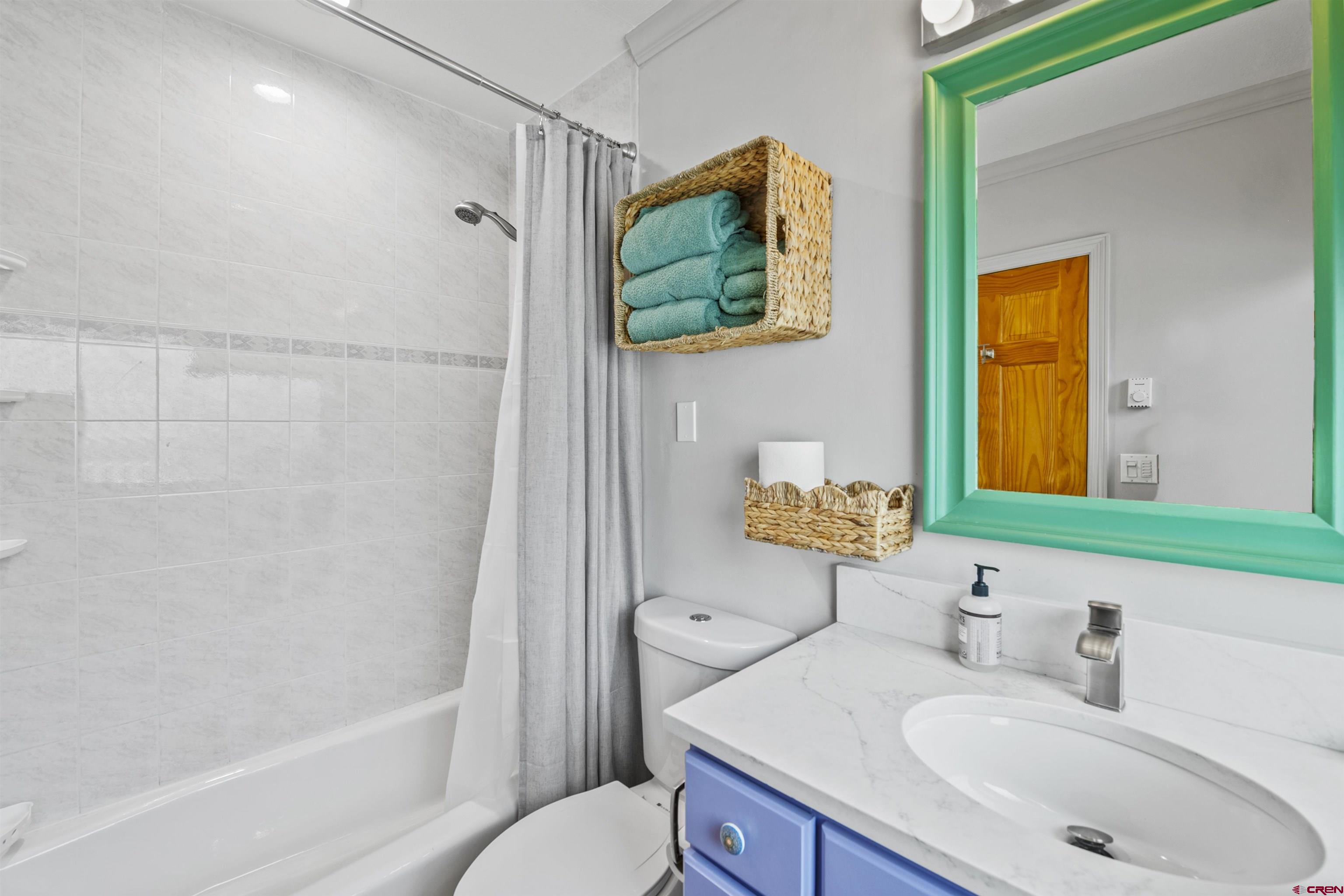 11 Snowmass Road, Unit 33 Crested Butte, CO 81225 - Photo 29 of 34 a bathroom with a sink toilet and shower