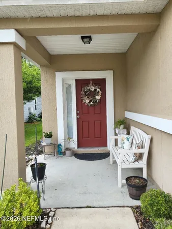 a bedroom with bed and window