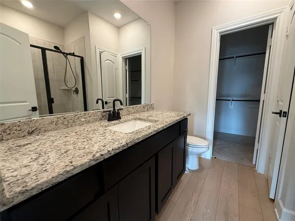 a bathroom with a sink double vanity and a mirror