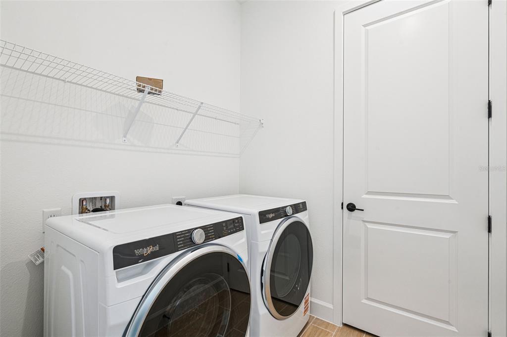 2006 Beach Terrace Celebration, FL 34747 - Photo 20 of 31 a utility room with dryer and washer