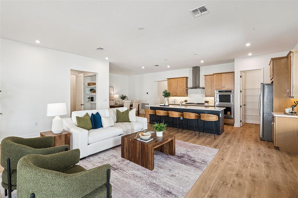 2006 Beach Terrace Celebration, FL 34747 - Photo 7 of 31 a living room with furniture and kitchen view
