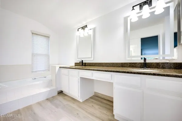 a bathroom with a sink and a bathtub