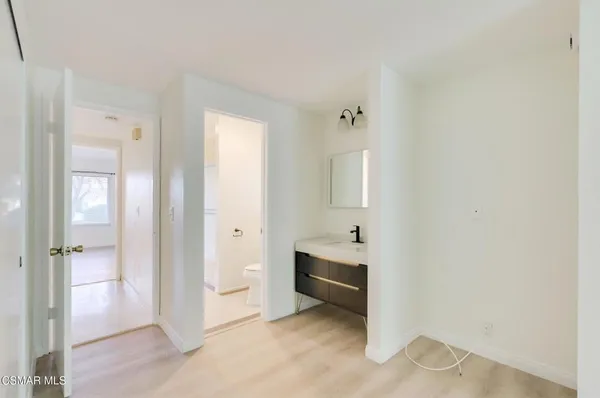 a view of a room that has a bathroom in it