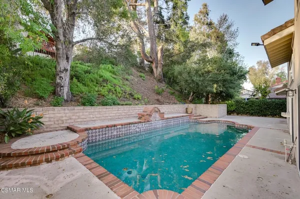 a view of a backyard with sitting area