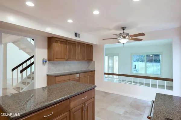 a view of an entryway with a kitchen
