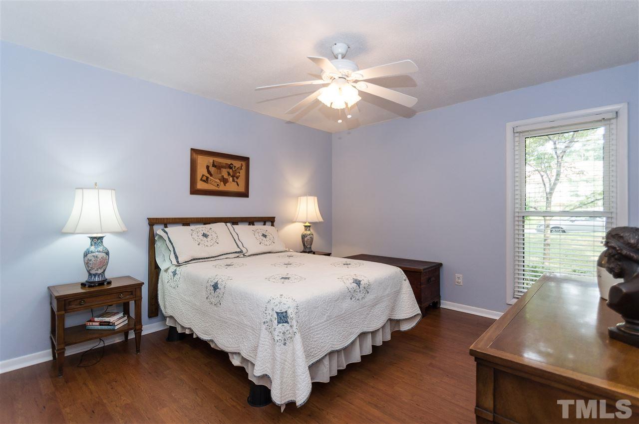 1421 Fairway Ridge Drive Raleigh, NC 27606 - Photo 13 of 19 a bedroom with a bed and a window