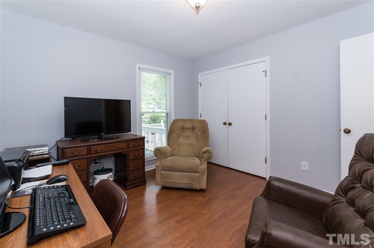 1421 Fairway Ridge Drive Raleigh, NC 27606 - Photo 15 of 19 a living room with furniture and a flat screen tv