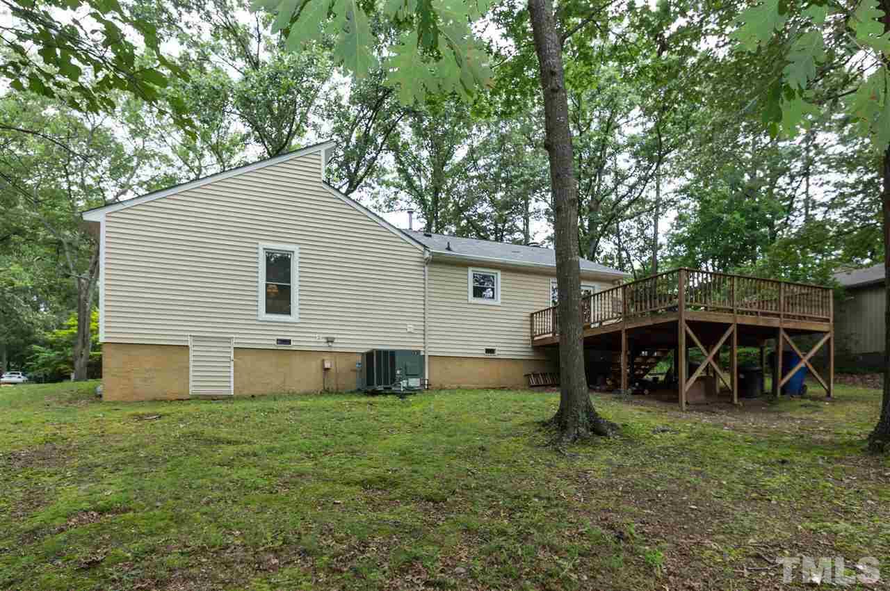 1421 Fairway Ridge Drive Raleigh, NC 27606 - Photo 18 of 19 a view of a house with backyard