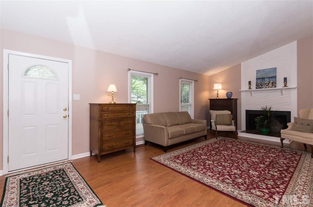 1421 Fairway Ridge Drive Raleigh, NC 27606 - Photo 4 of 19 a living room with furniture and a rug