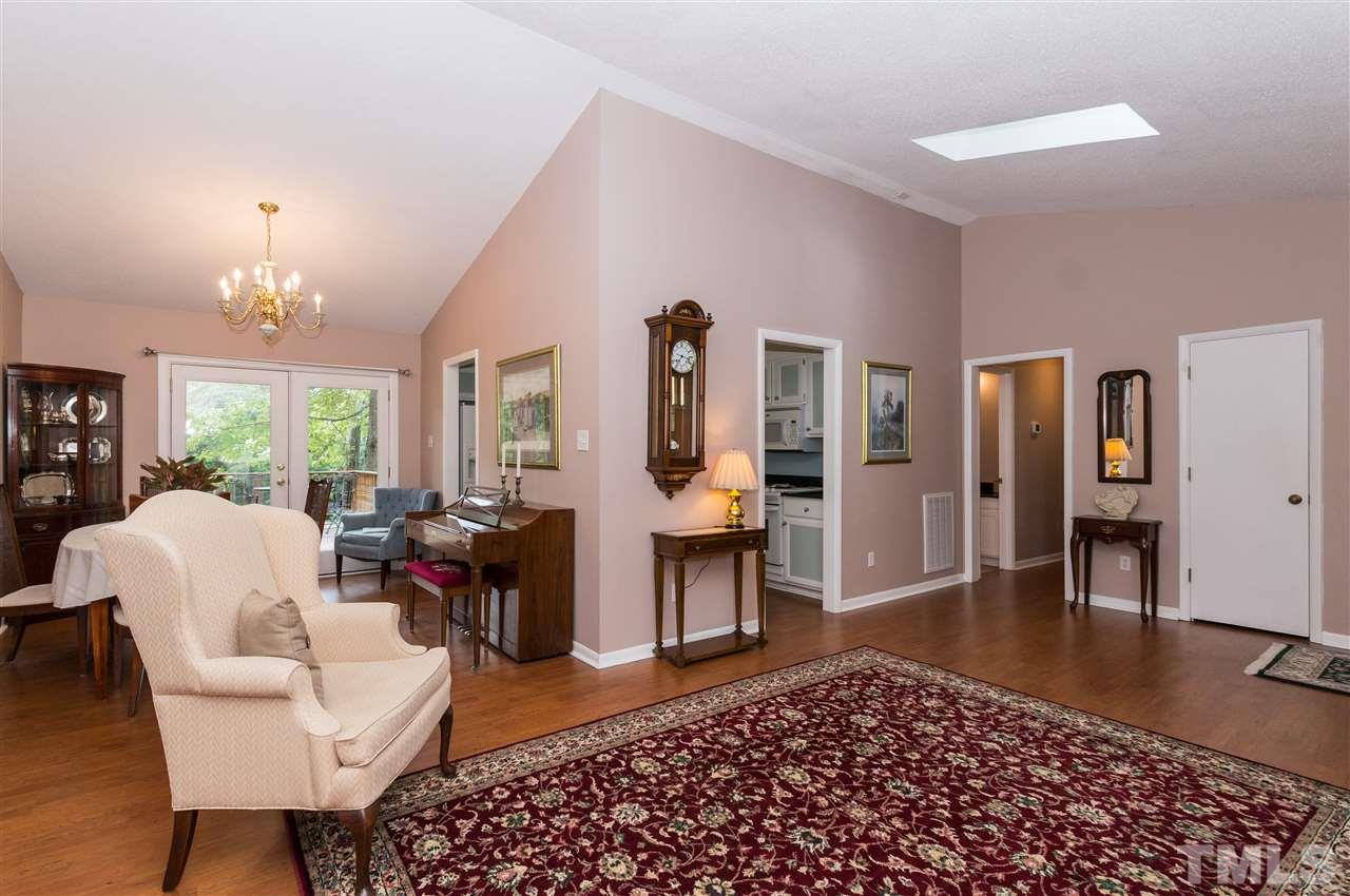 1421 Fairway Ridge Drive Raleigh, NC 27606 - Photo 5 of 19 a living room with furniture and a chandelier