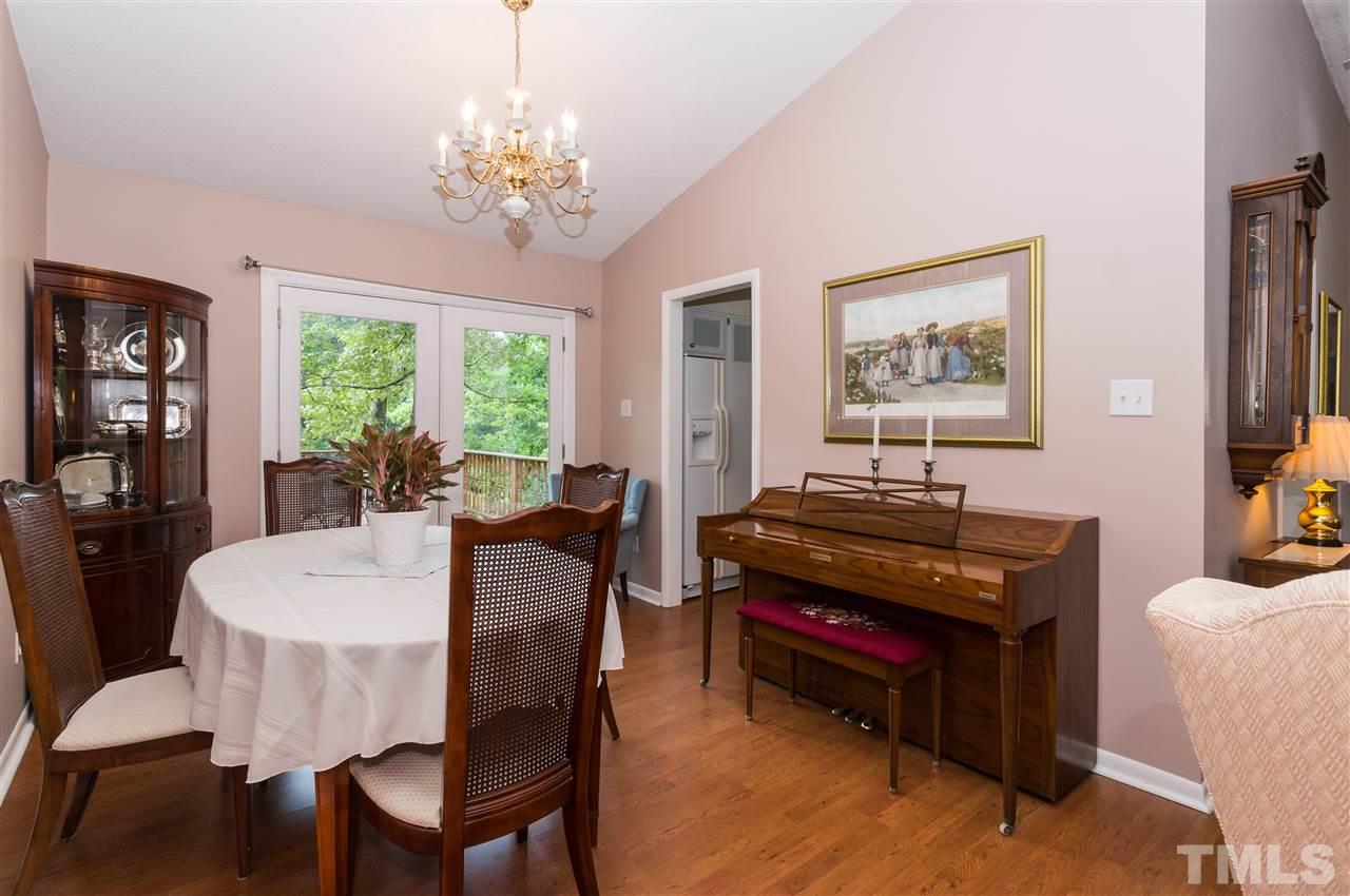 1421 Fairway Ridge Drive Raleigh, NC 27606 - Photo 6 of 19 a living room with furniture and a chandelier
