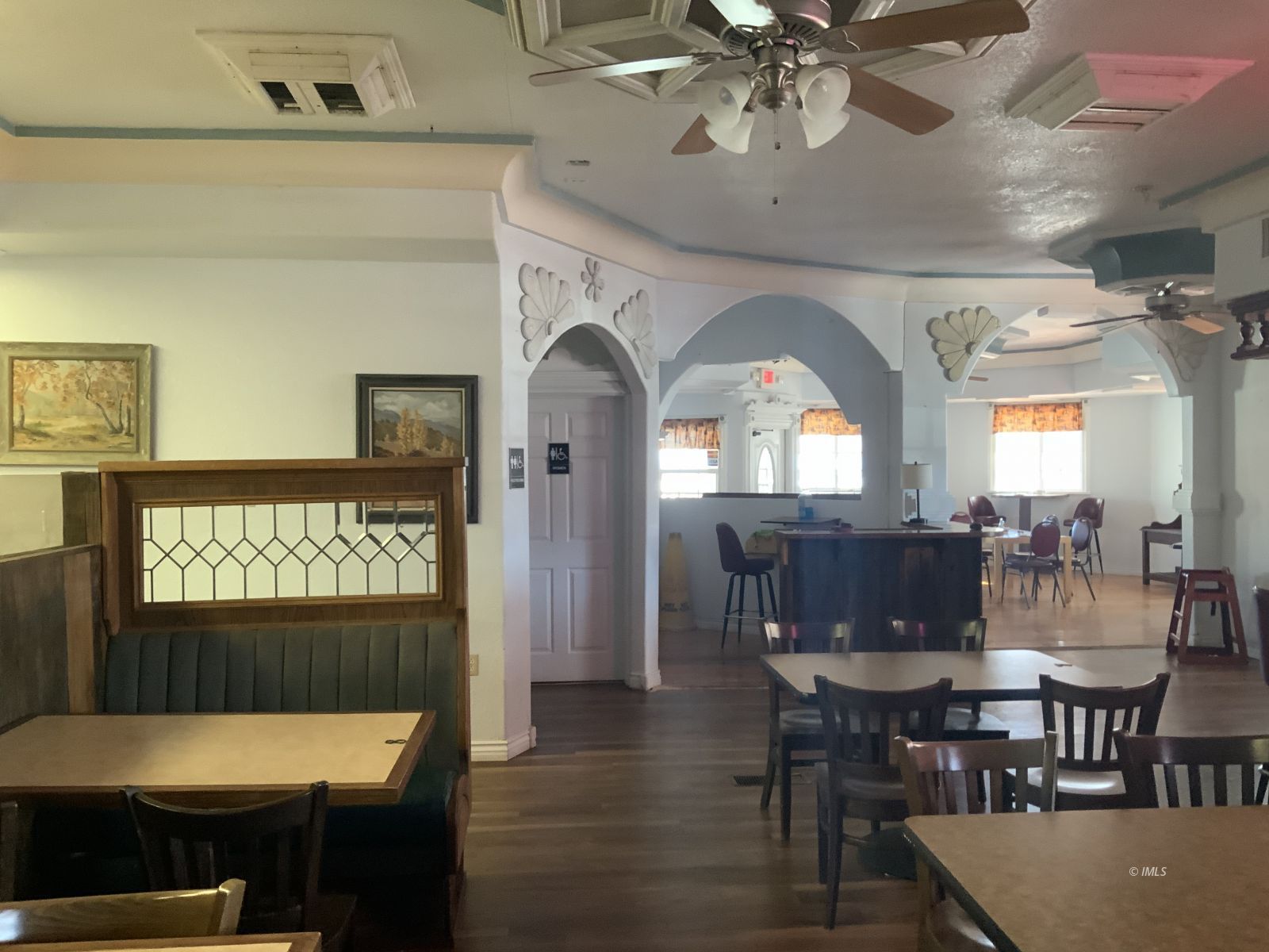 127 North Edwards Street Independence, CA 93526 - Photo 12 of 33 a dining room with a wooden table and chairs