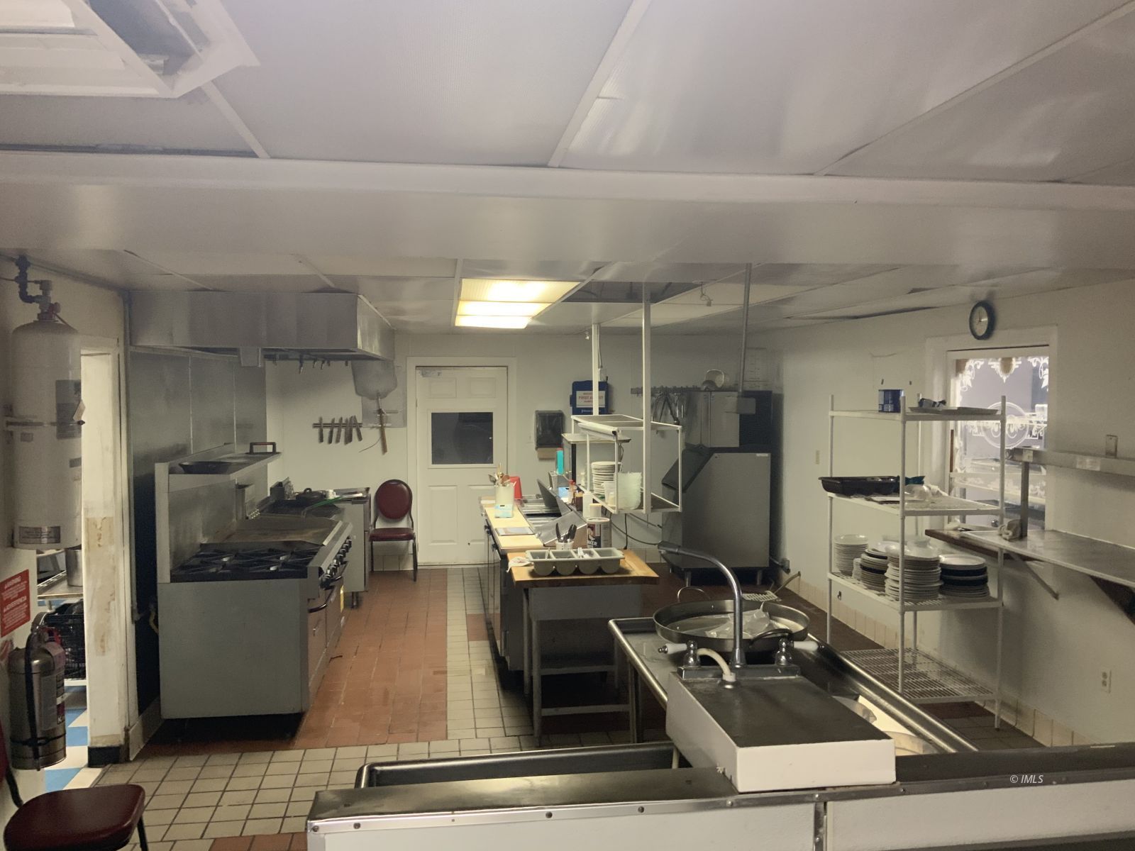 127 North Edwards Street Independence, CA 93526 - Photo 18 of 33 a room with lots of counter top space and furniture