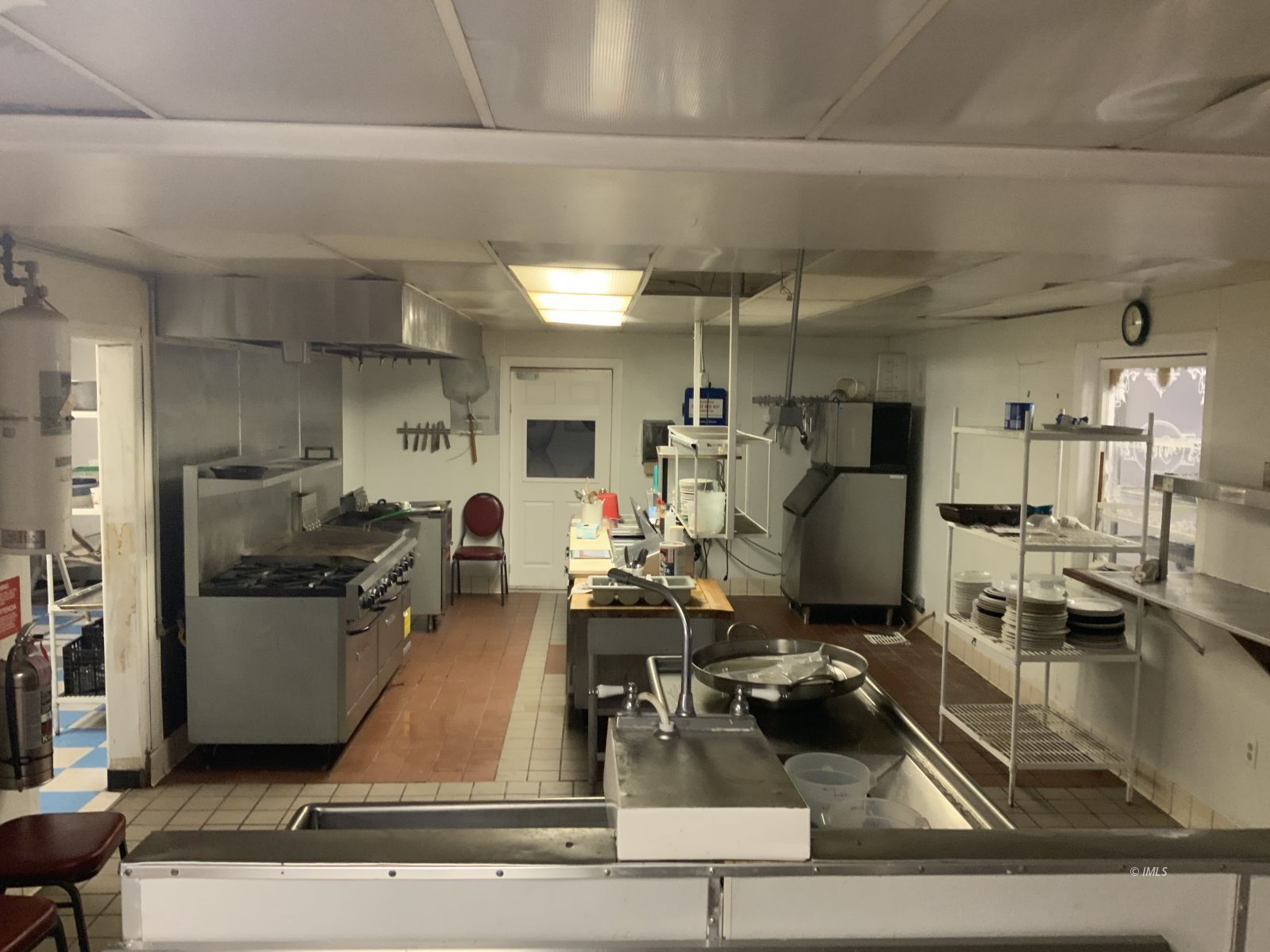 127 North Edwards Street Independence, CA 93526 - Photo 19 of 33 a room with lots of furniture and view kitchen