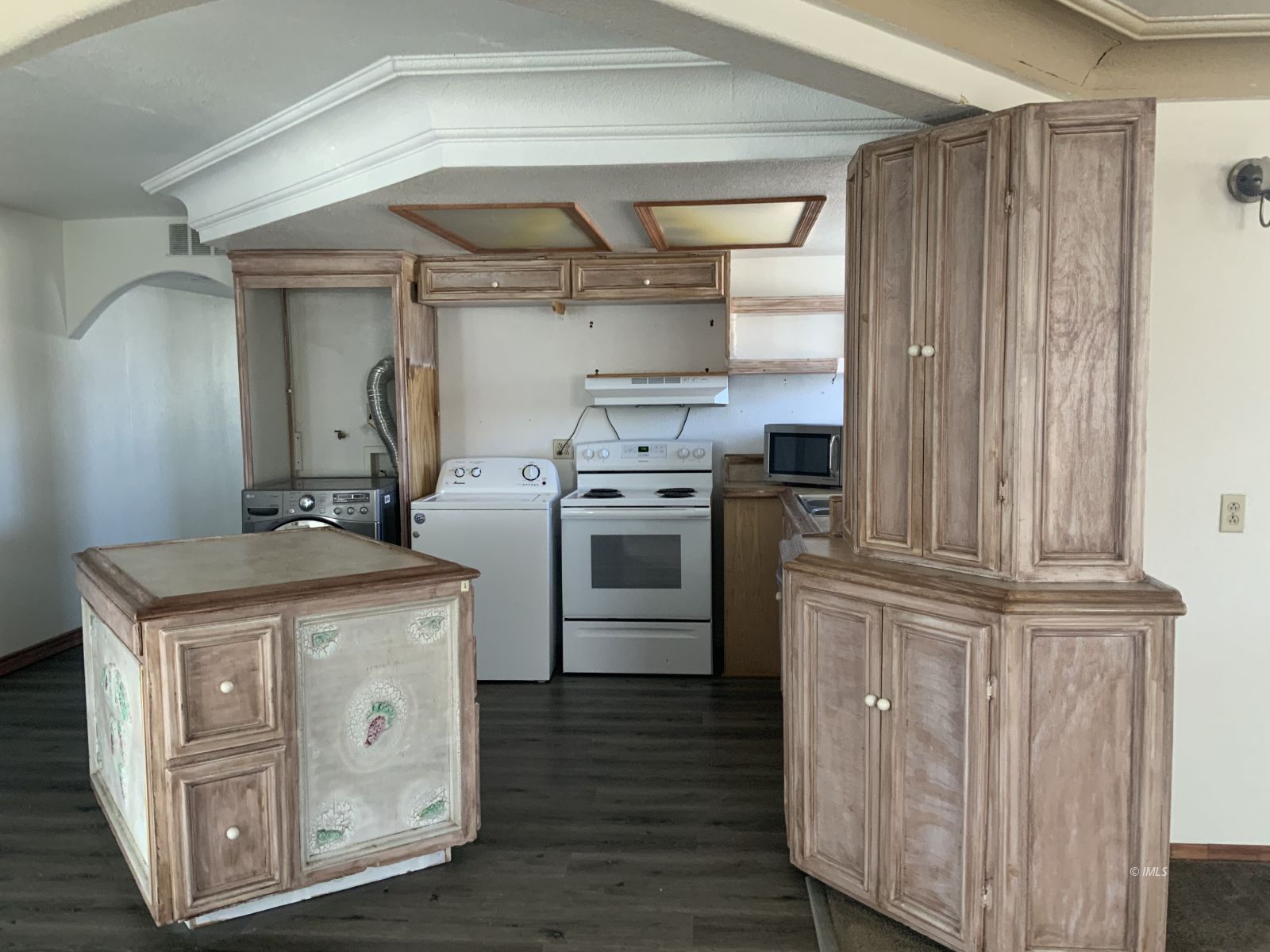 127 North Edwards Street Independence, CA 93526 - Photo 28 of 33 a kitchen with stainless steel appliances granite countertop a stove and a refrigerator