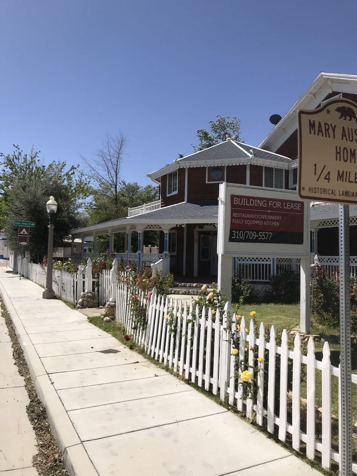 127 North Edwards Street Independence, CA 93526 - Photo 3 of 33 a front view of a house with glass door