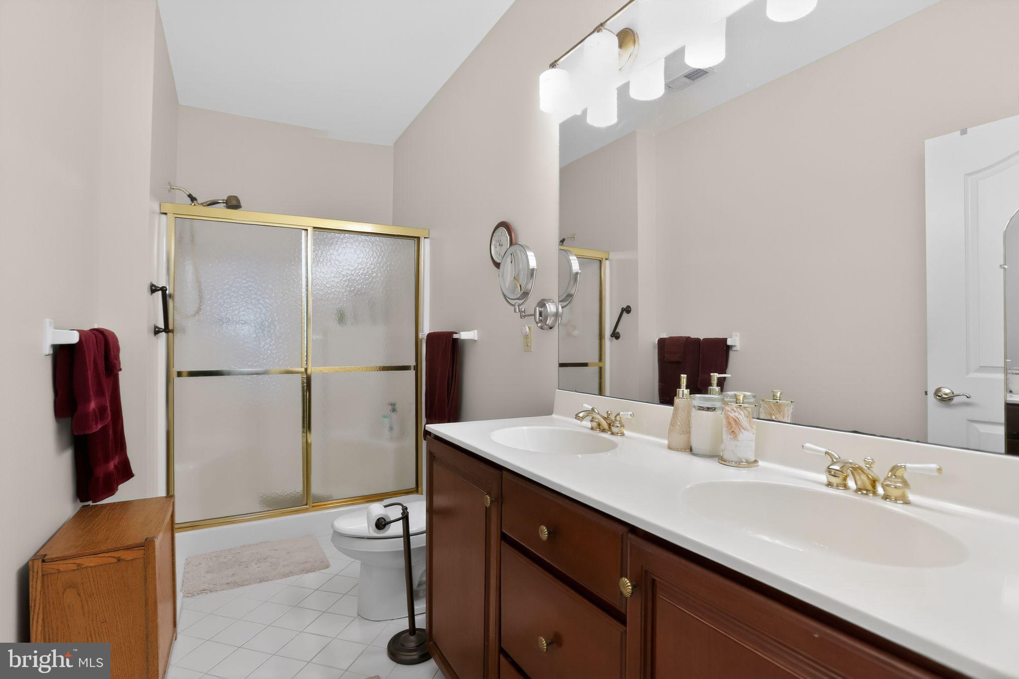 417 Ruth Court Harleysville, PA 19438 - Photo 20 of 28 a bathroom with a double vanity sink and a mirror
