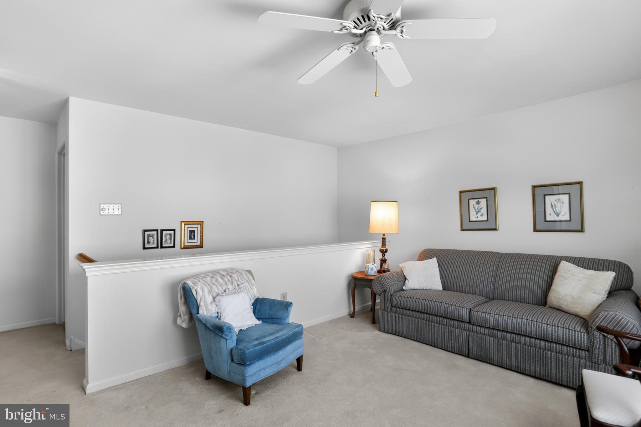 417 Ruth Court Harleysville, PA 19438 - Photo 24 of 28 a living room with furniture and a lamp