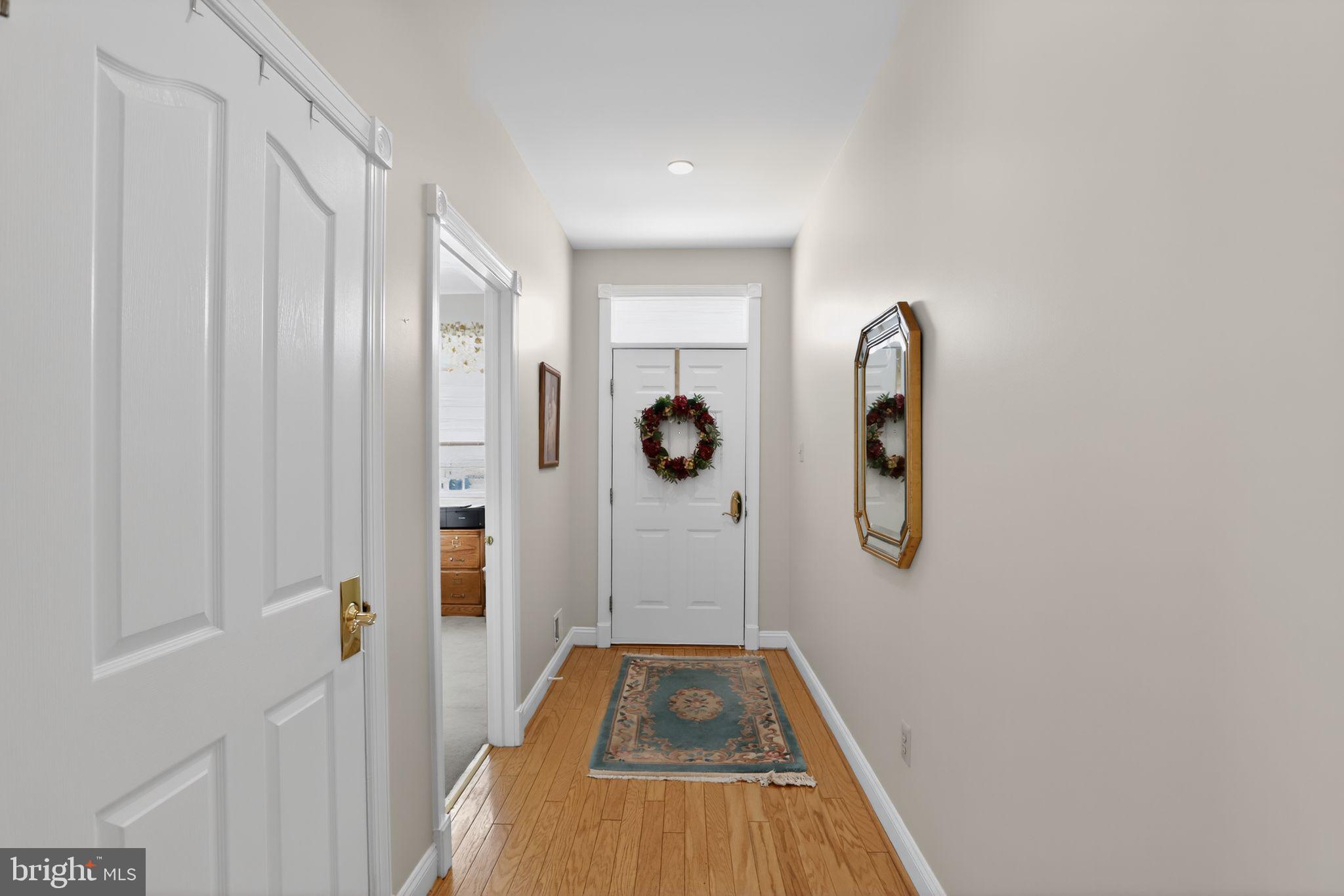 417 Ruth Court Harleysville, PA 19438 - Photo 5 of 28 a view of a hallway with wooden floor and staircase